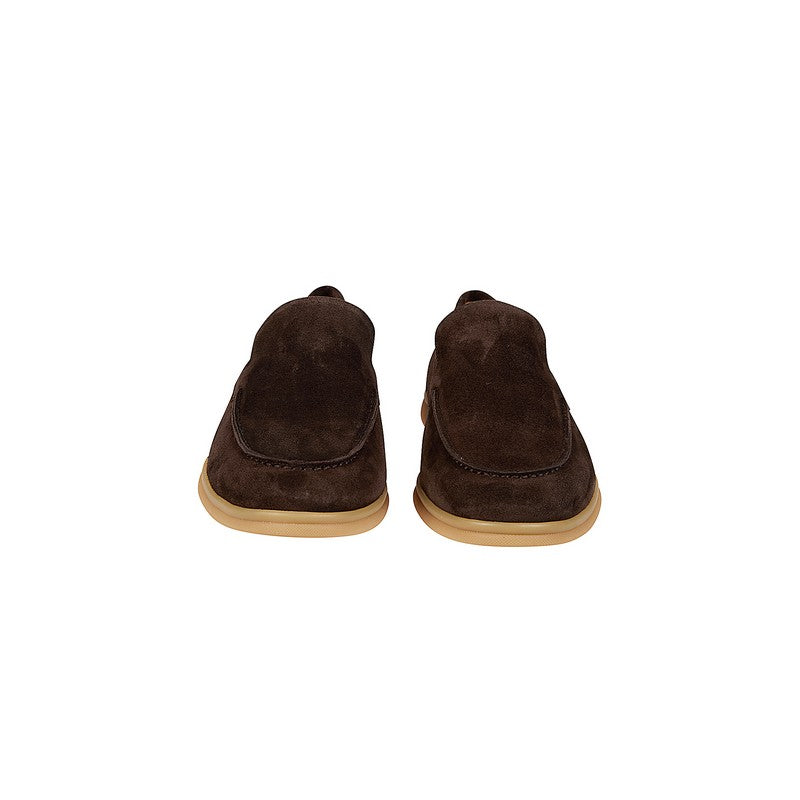 Pair of brown suede shoes on a white background